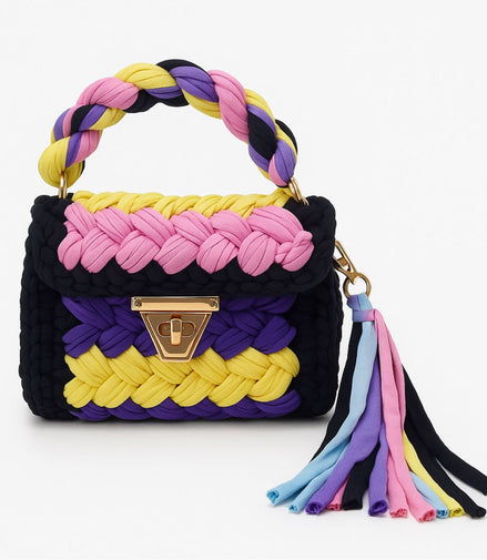 Colorful braided handbag with a tassel on a white background