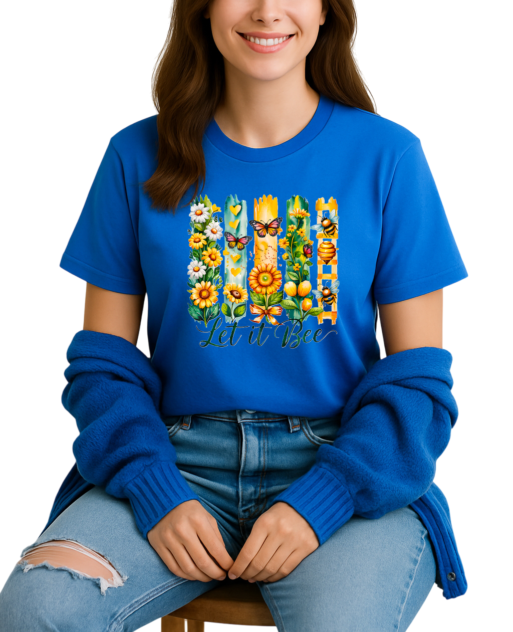 Person wearing a blue t-shirt with a colorful graphic design and text.