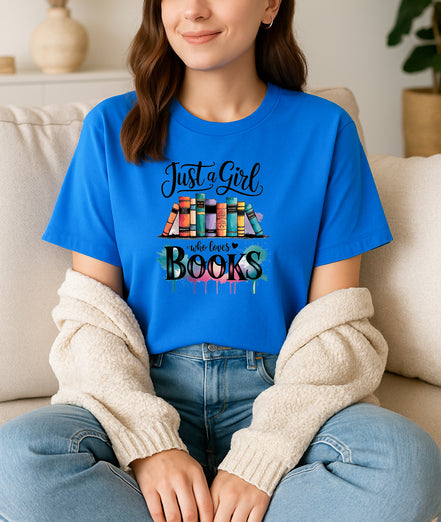 Woman wearing white Just a Girl Who Loves Books graphic T-shirt, handmade organic cotton literary tee for book lovers and readers