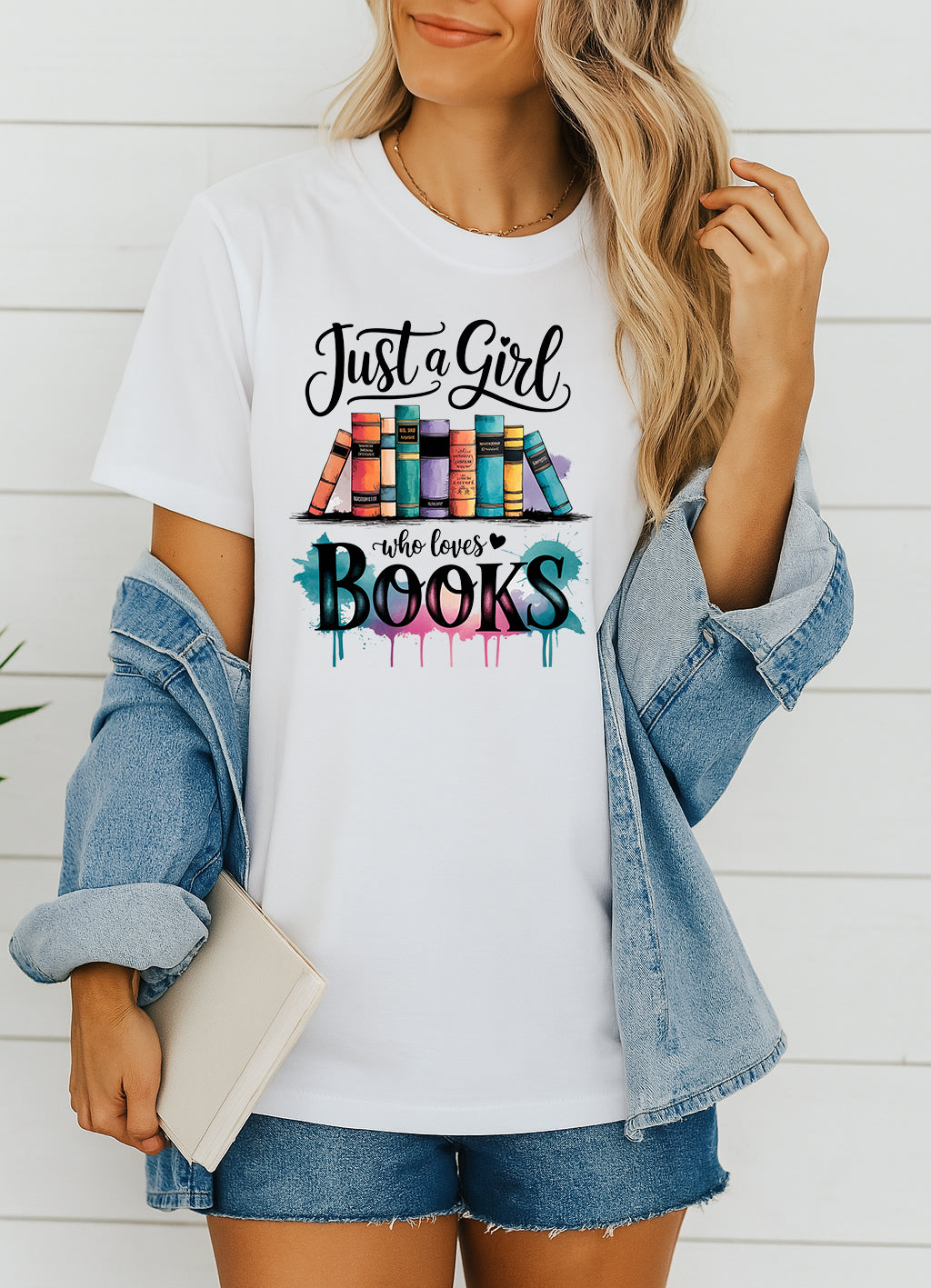 Woman wearing white Just a Girl Who Loves Books graphic T-shirt, handmade organic cotton literary tee for book lovers and readers