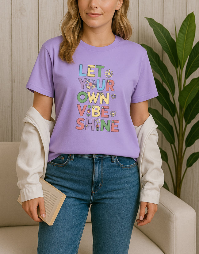Handmade “Let Your Own Vibe Shine” graphic T-shirt, crafted from organic cotton. Colorful retro design to spread positivity and showcase your unique style.