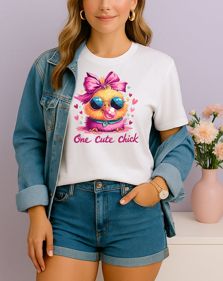 Woman wearing white One Cute Chick graphic T-shirt with a chick in sunglasses blowing bubblegum, handmade organic cotton fun fashion tee
