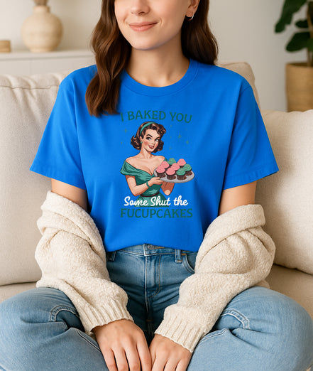 Woman wearing blue I Baked You Some Shut the Fucupcakes retro pin-up graphic T-shirt, handmade organic cotton witty statement fashion tee.