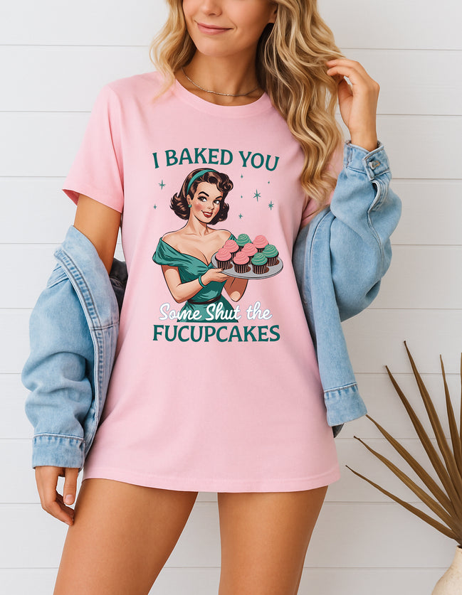 Woman wearing pink I Baked You Some Shut the Fucupcakes retro pin-up graphic T-shirt, handmade organic cotton witty statement fashion tee.