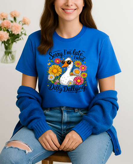Woman wearing blue Sorry I’m Late I Was Dilly Dallying graphic T-shirt with duck and flowers, handmade organic cotton fun and casual fashion tee