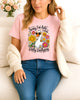 Woman wearing pink Sorry I’m Late I Was Dilly Dallying graphic T-shirt with duck and flowers, handmade organic cotton fun and casual fashion tee
