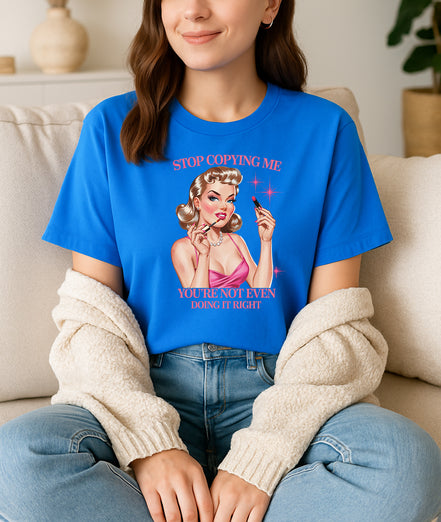 Woman wearing navy Stop Copying Me You’re Not Even Doing It Right retro pin-up graphic T-shirt, handmade organic cotton bold fashion tee