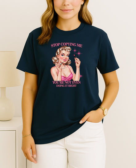 Handmade “Stop Copying Me, You’re Not Even Doing It Right” retro pin-up T-shirt, crafted from organic cotton. Witty, bold, and unique statement fashion.