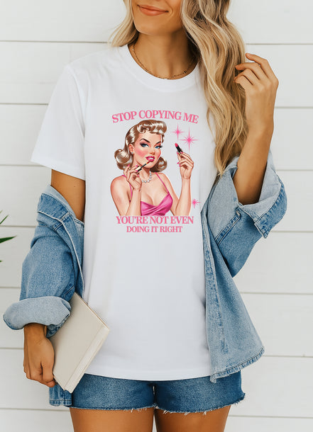 Woman wearing navy Stop Copying Me You’re Not Even Doing It Right retro pin-up graphic T-shirt, handmade organic cotton bold fashion tee