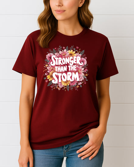 Woman wearing Maroon Stronger Than the Storm floral graphic T-shirt, handmade organic cotton empowering fashion tee