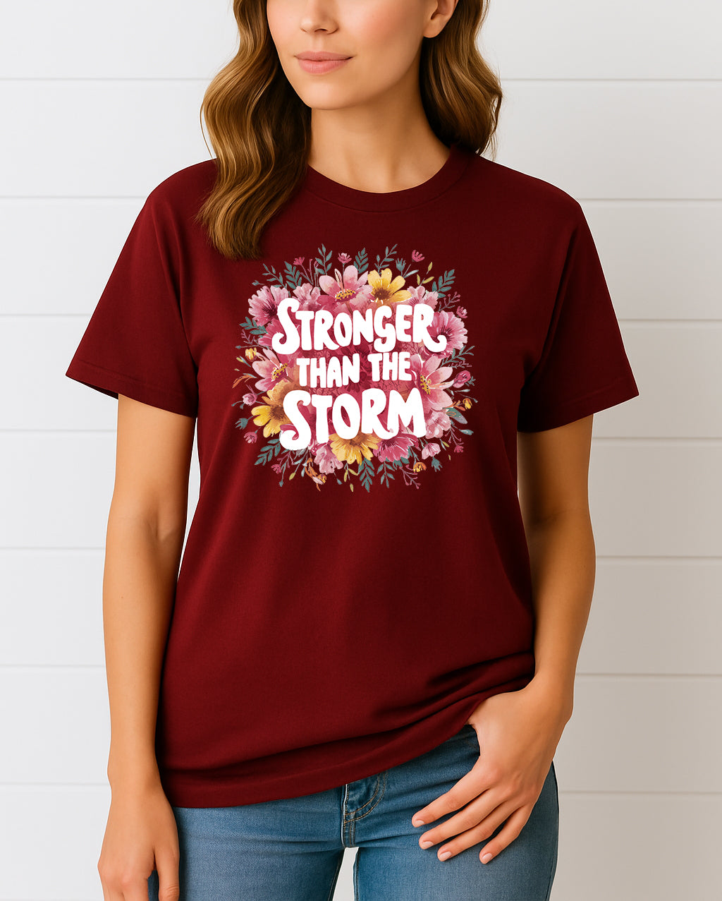 Woman wearing Maroon Stronger Than the Storm floral graphic T-shirt, handmade organic cotton empowering fashion tee