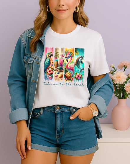 Woman wearing white Take Me to the Beach tropical graphic T-shirt with parrots, flamingos, and dolphins, handmade organic cotton summer fashion tee