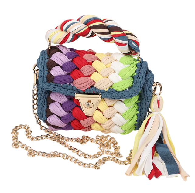 Colorful woven handbag with braided handle and tassel on a white background