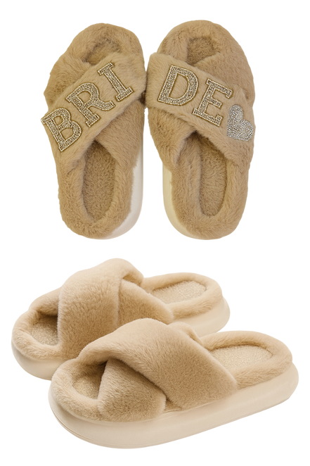 Pair of beige slippers with 'Bride' and heart designs on a white background