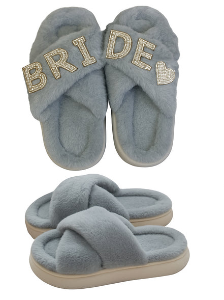 Pair of blue slippers with 'BRIDE' text on a white background