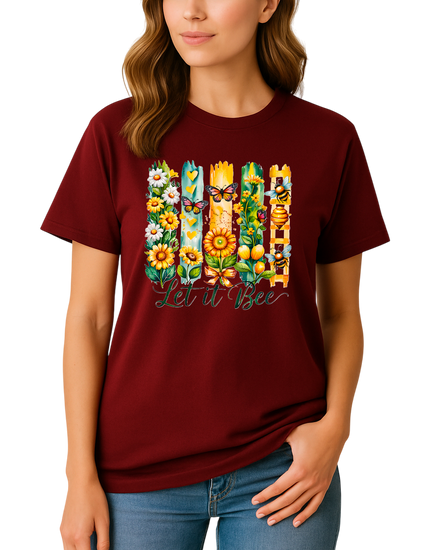 Woman wearing a maroon t-shirt with floral and bee design and text 'Let it Bee'.
